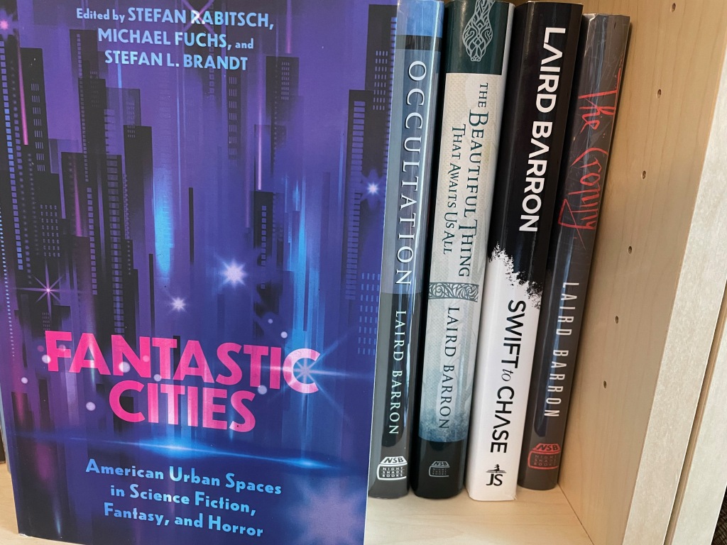 contributor's copy of FANTASTIC CITIES on bookshelf