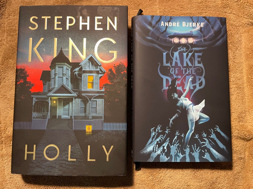 Hardback print editions of Stephen King's HOLLY and Andre Bjerknes THE LAKE OF THE DEAD